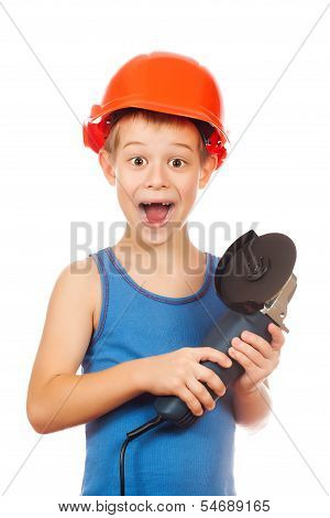 little boy in a helmet with electric hammer