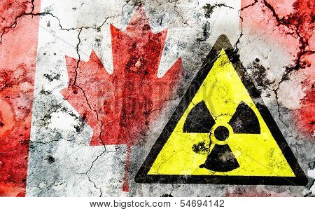 Old Cracked Wall With Radiation Warning Sign And Painted Flag