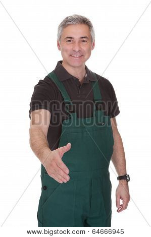 Mature Male Gardner Offering Handshake