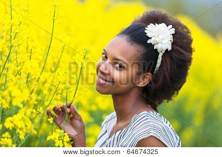 Outdoor Portrait Of A Young Beautiful African American Woman In A Rape Colza Field - Black People