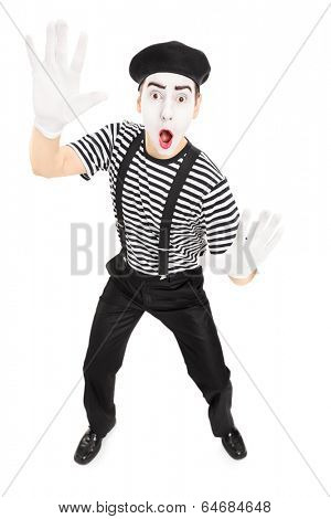 Male actor mimicking with hands isolated on white background