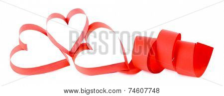 Heart shaped red paper ribbon isolated on white