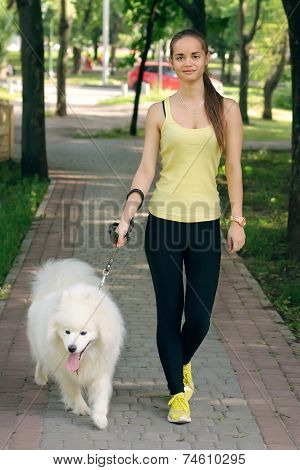 Girl With A Dog For A Walk