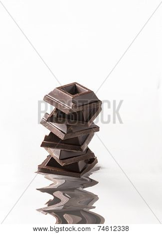 squares of chocolate on white background