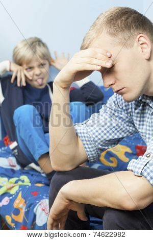 Tired Father And Bratty Son
