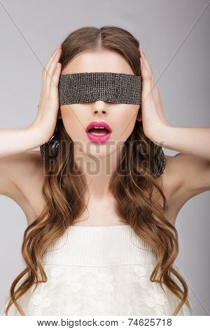 Confusion. Woman Holding Headband On Her Head