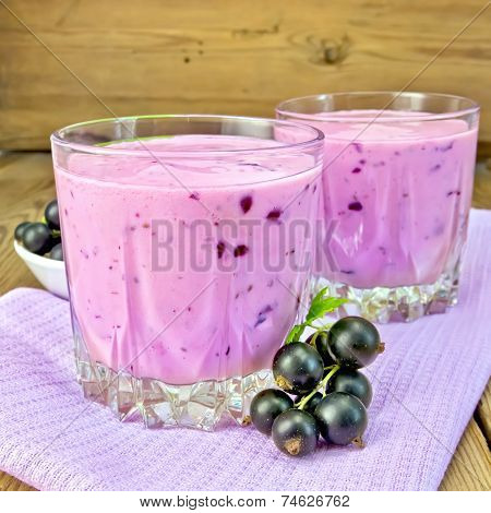 Milkshake with black currants on napkin