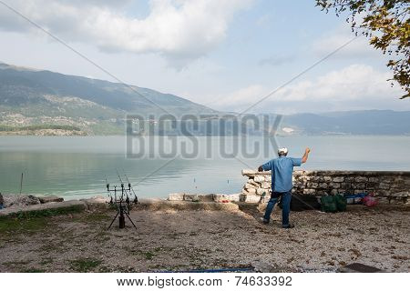 Fisherman By Lake