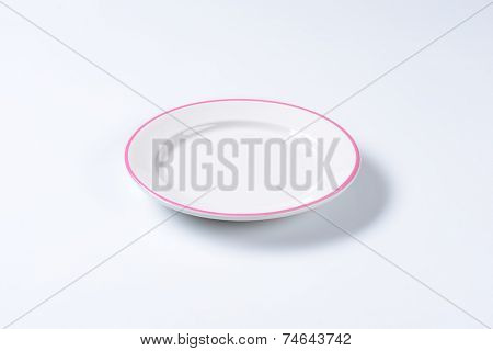 empty lunch plate with pink edge