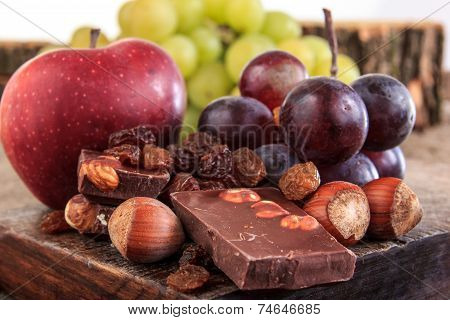 Bunch Of Fruit Apples And Grapes With Nuts Chocolate