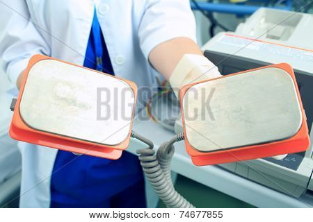 Plates Defibrillator In The Hands Of The Doctor Is Ready To Save A Life
