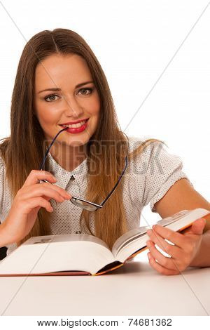 Happy Asian Caucasian Girl Lerning In Study Woth Lots Of Books On The Table