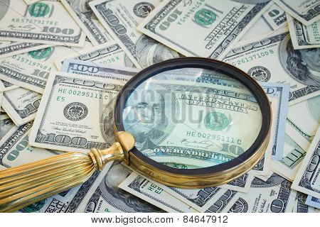 money under manifying glass