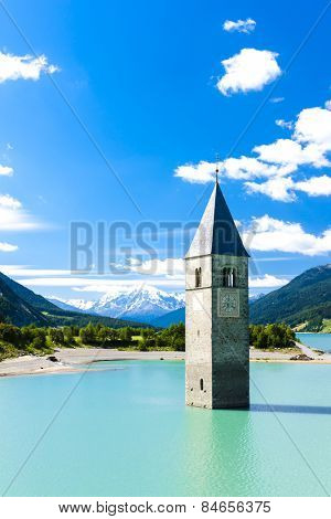 tower of sunken church in Resia lake, South Tyrol, Italy
