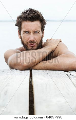 Sexy Handsome Man With Beard And No Shirt At The Sea