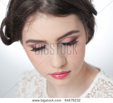 Hairstyle and make up - beautiful young girl art portrait with closed eyes. Genuine natural brunette