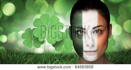 Brunette in irish face paint against green glowing background