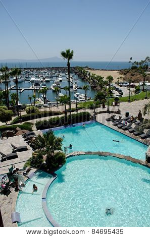 ENSENADA, BAJA CALIFORNIA, MEXICO- AUGUST 23, 2015: Resort with swiming pool and a yacht club in a sunny day in Ensenada, Baja California, Mexico
