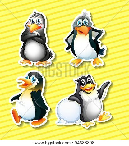 Set of four panguin stickers on yellow background