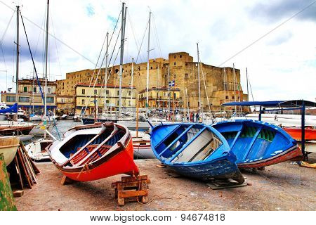 Castel dell'Ovo and old boats. Naples, Italy