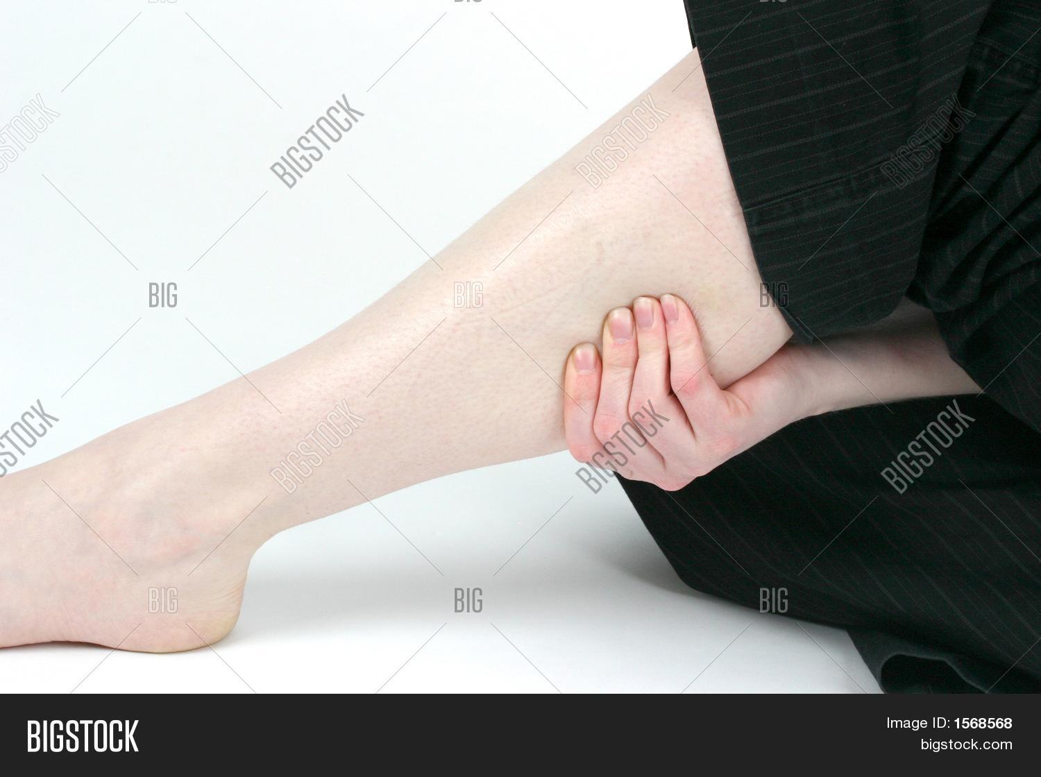 Woman Holding Sore Leg Image & Photo (Free Trial) Bigstock