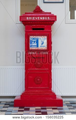 Retro dutch red mail box in a post offfice