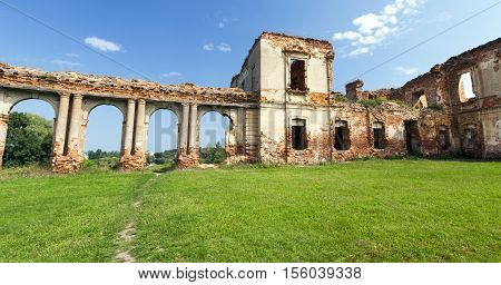 the ruins picture ancient fortress of the 16th century, situated in the village of Ruzhany Grodno region, Belarus, ruined arch against a blue sky