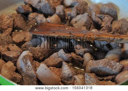 Afelia. Cypriot national dish of marinated and stewed pork in aromatic spices.