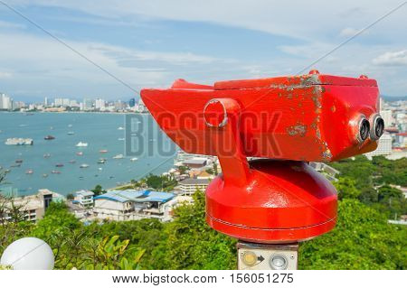Stationary observation binoculars at viewpoint Pratumnak Hill in Pattaya, Thailand.