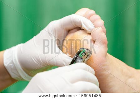 Pedicure  procedure in the beauty salon.  emover calluses on the feet. Foot care.