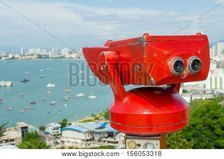 Stationary observation binoculars at viewpoint Pratumnak Hill in Pattaya, Thailand.