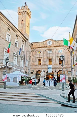 LORETO ITALY - OCTOBER 6 2012: The old brick tower of the Municipal Palace with the Garibaldi bust in the small square on October 6 in Loreto.