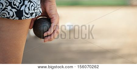 Senior playing petanque fun and relaxing game