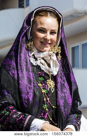 SELARGIUS, ITALY - September 11, 2016: Former marriage Selargino - Sardinia - portrait of a beautiful woman in traditional Sardinian costume