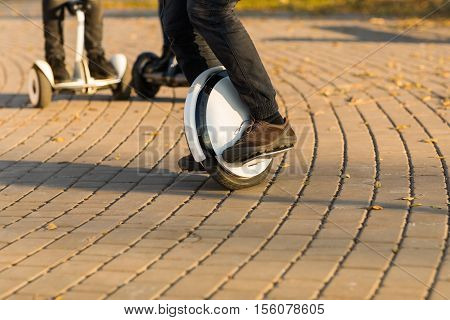 Man legs mono wheel personal electrical transport street outdoor