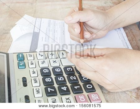 hand checking document monthly credit card expenses accounting