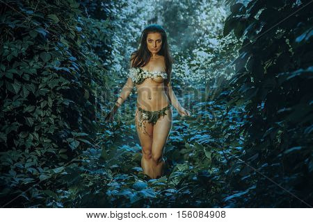 horizontal portrait of sensual young girl in underwear leaf looking at the camera