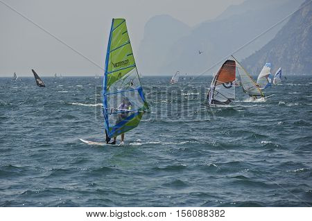 Torbole - Nago, Lago di Garda (Lago Benaco), Italy - August 11, 2015: A windsurfing on Lake Garda in Torbole resort.