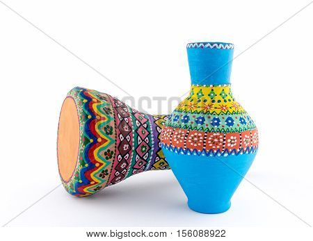 Two pieces of colorful painted potteries an Egyptian drinking jar (arabic: Kolla) and a goblet drum (also chalice drum tarabuka darbuka debuka)