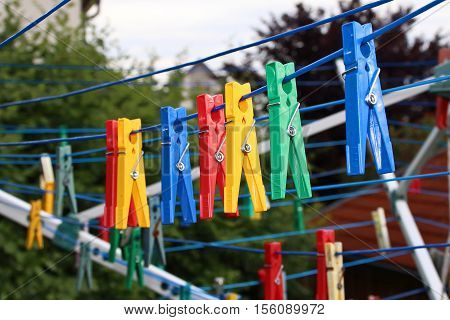 Close up of a colored clothespins on a clothesline