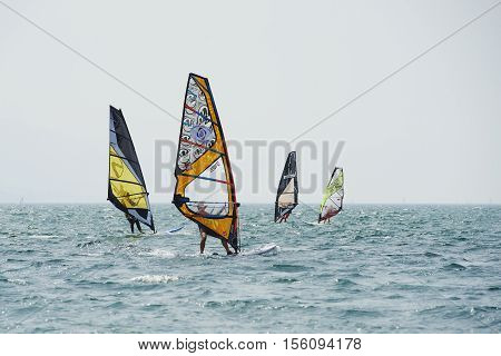 Torbole - Nago, Lago di Garda (Lago Benaco), Italy - August 11, 2015: A windsurfing on Lake Garda in Torbole resort.