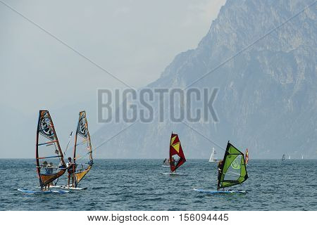 Torbole - Nago, Lago di Garda (Lago Benaco), Italy - August 11, 2015: A windsurfing on Lake Garda in Torbole resort.