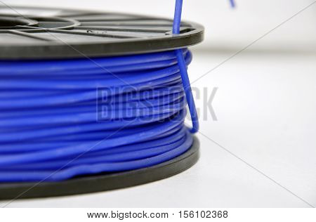 Blue 3d printing filament spool, close up