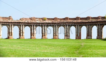 the ruins picture ancient fortress of the 16th century, situated in the village of Ruzhany Grodno region, Belarus, ruined arch against a blue sky