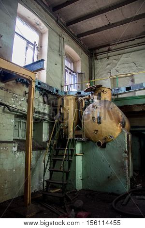 Old equipment tank alcoholmeters in in an abandoned Voronezh Distillery