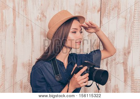 Young Pretty Woman With Camera Looking For New Cadre