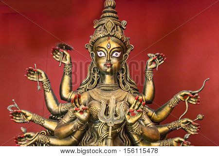 Goddess Durga idol copper finish closeup portrait. Goddess durga is worshipped by Hindus in India and abroad and depicts victory of good over evil.