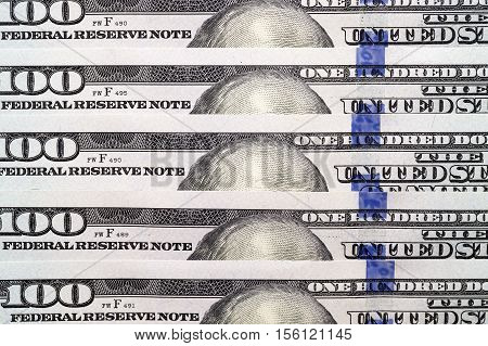 put together the American dollars. Photo close-up of banknotes on 100