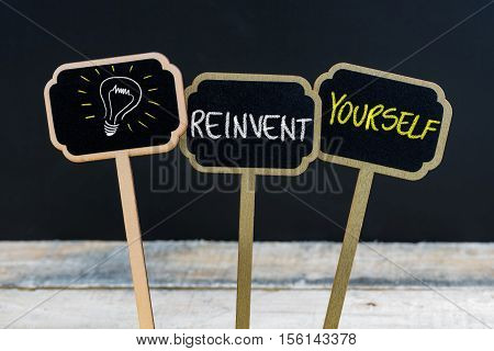 Concept Message Reinvent Yourself And Light Bulb As Symbol For Idea