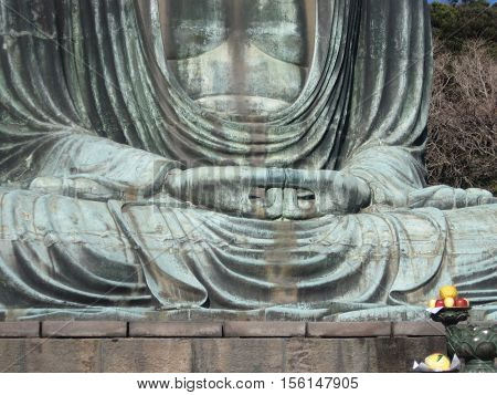 Two hands of outdoor bronze statue of Buddha in Kamakura, Kanagawa Prefecture, Japan